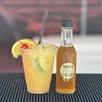Mai-Tai'm to Remember cocktail with orange and cherry garnish